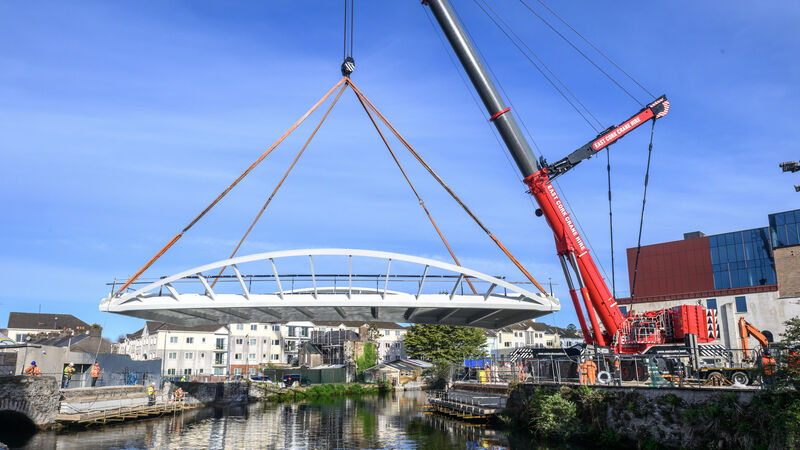 Watch: Pedestrian bridge lifted into place across Cork's Lee