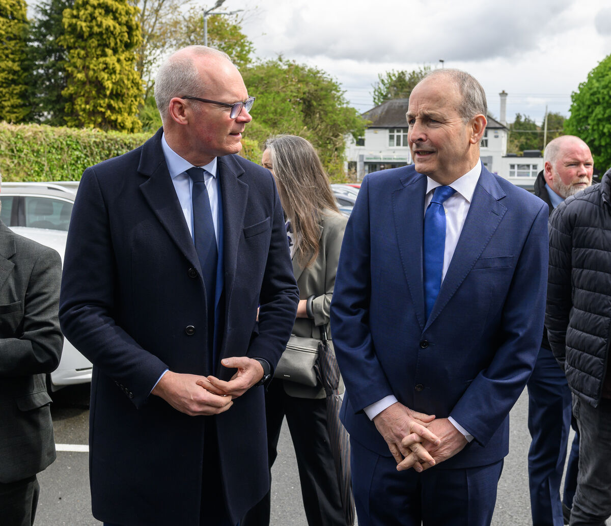 Taoiseach Micheál Martin with former tánaiste Simon Coveney at the Church of the Holy Spirit, Dennehy’s Cross, Cork, attending the Liturgy of the Word for the late John Mullins. Picture: Dan Linehan