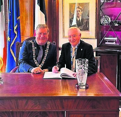 Lord Mayor of Cork, councillor Dan Boyle, with Paddy O’Connell signing the book at the Lord Mayor’s Chambers at City Hall.