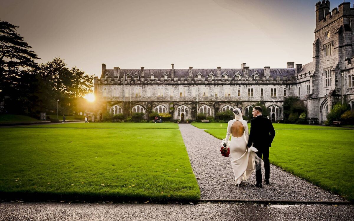The couple pictured at the Quad in UCC with the December sun setting in the background. After the ceremony, they held a reception for their guests at Hayfield Manor. The couple pictured at the Quad in UCC with the December sun setting in the background. After the ceremony, they held a reception for their guests at Hayfield Manor.