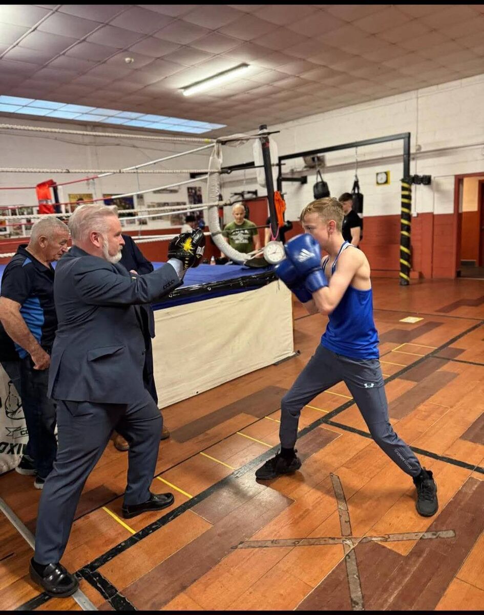 Ken O'Flynn, TD enjoying a spar with a Glen BC boxer during his visit to the Tomas MacCurtin Boxing Museum located in the Glen Boxing Club.