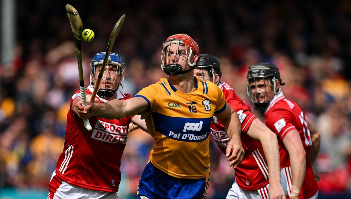 Peter Duggan of Clare in action against Cork players Seán O’Donoghue, Eoin Downey and Darragh Fitzgibbon. Picture: Brendan Moran/Sportsfile