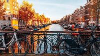 Bicycles parked on a bridge in Amsterdam
