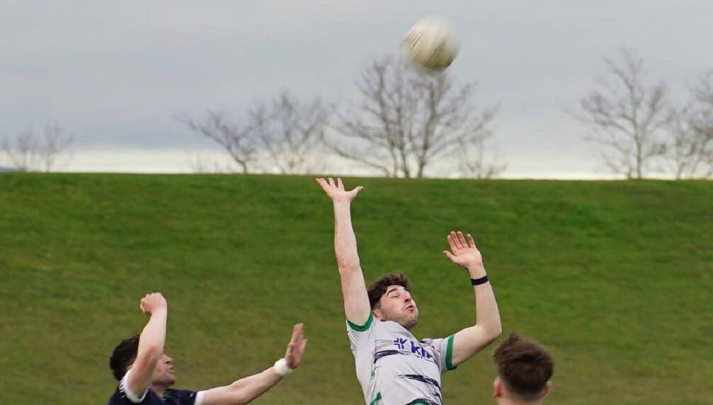 Goleen's Michael O'Reilly jumps for the ball in the Munster Junior football final for UL this year. 