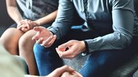 Couple counseling or therapy session. Man talking about problems in the family. Husband and wife meeting their psychiatrist.