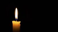 Single lit candle with quite flame