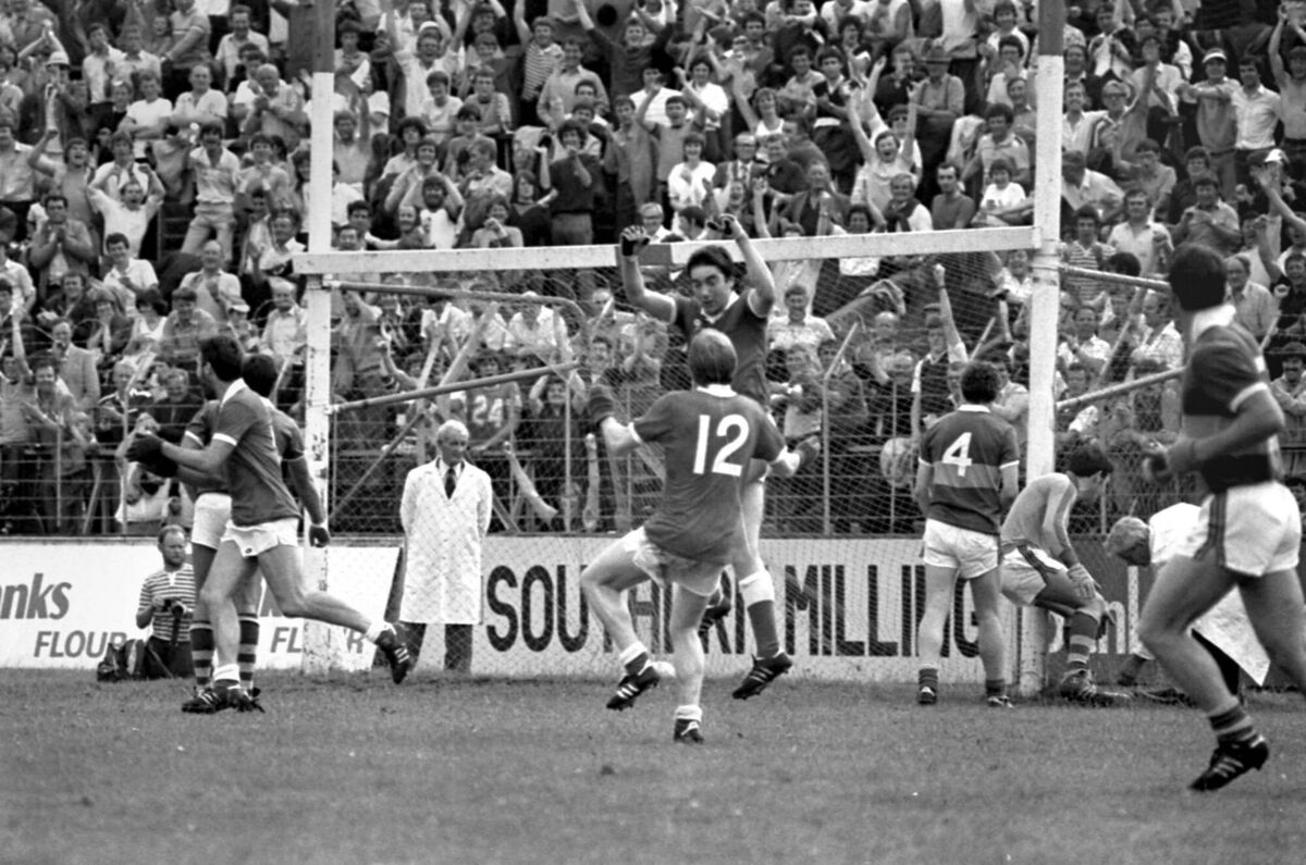 Cork v. Kerry in the Munster senior football final at Pairc Ui Chaoimh in 1983. Cork wing-forward Tadgh Murphy celebrates scoring his side's second goal with Dave Barry, while Kerry goalkeeper Charlie Nelligan disputes the decision with the umpire Cork v. Kerry in the Munster senior football final at Pairc Ui Chaoimh in 1983. Cork wing-forward Tadgh Murphy celebrates scoring his side's second goal with Dave Barry, while Kerry goalkeeper Charlie Nelligan disputes the decision with the umpire