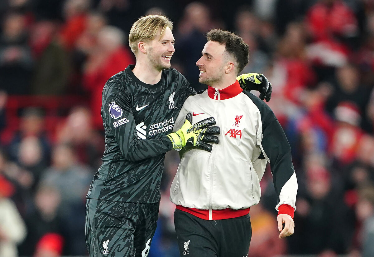 Liverpool goalkeeper Caoimhin Kelleher celebrates with  Liverpool's Diogo Jota following the Premier League match against Everton at Anfield, Liverpool. Picture: Peter Byrne/PA Wire