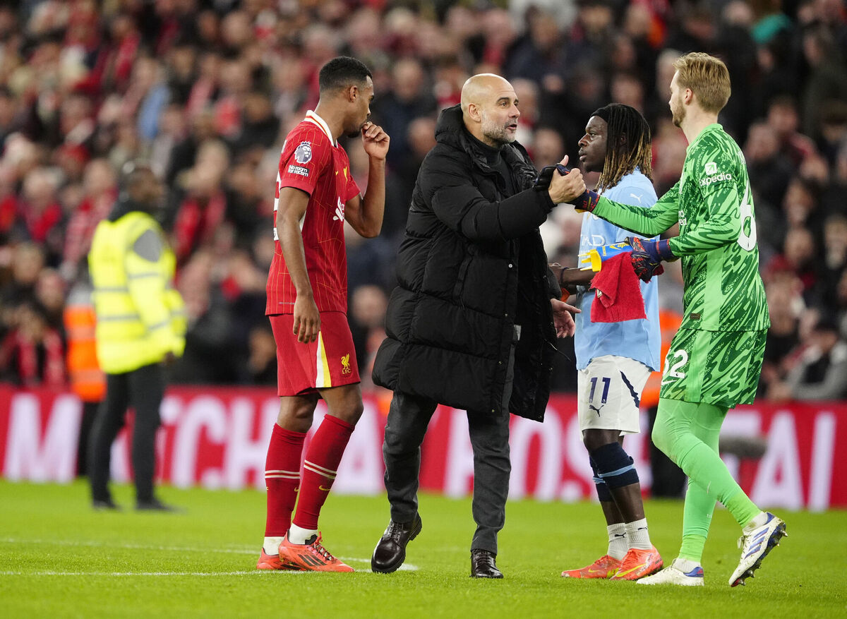 Manchester City manager Pep Guardiola shakes hands with Liverpool goalkeeper Caoimhin Kelleher during the Premier League match at Anfield, Liverpool. Picture: Peter Byrne/PA Wire