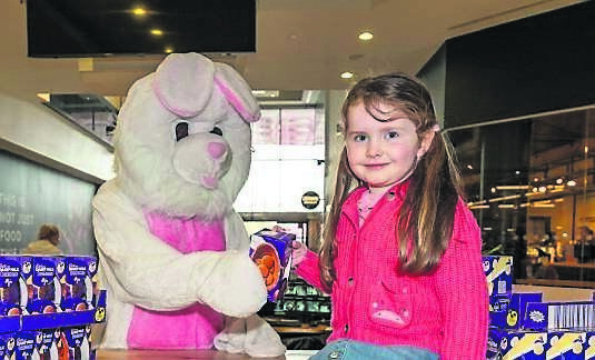 Emily O’Brien from Carrigaline and the Easter Bunny, celebrate the Easter egg Hunt at Douglas Village Shopping Centre. Picture: Noel Sweeney
                    