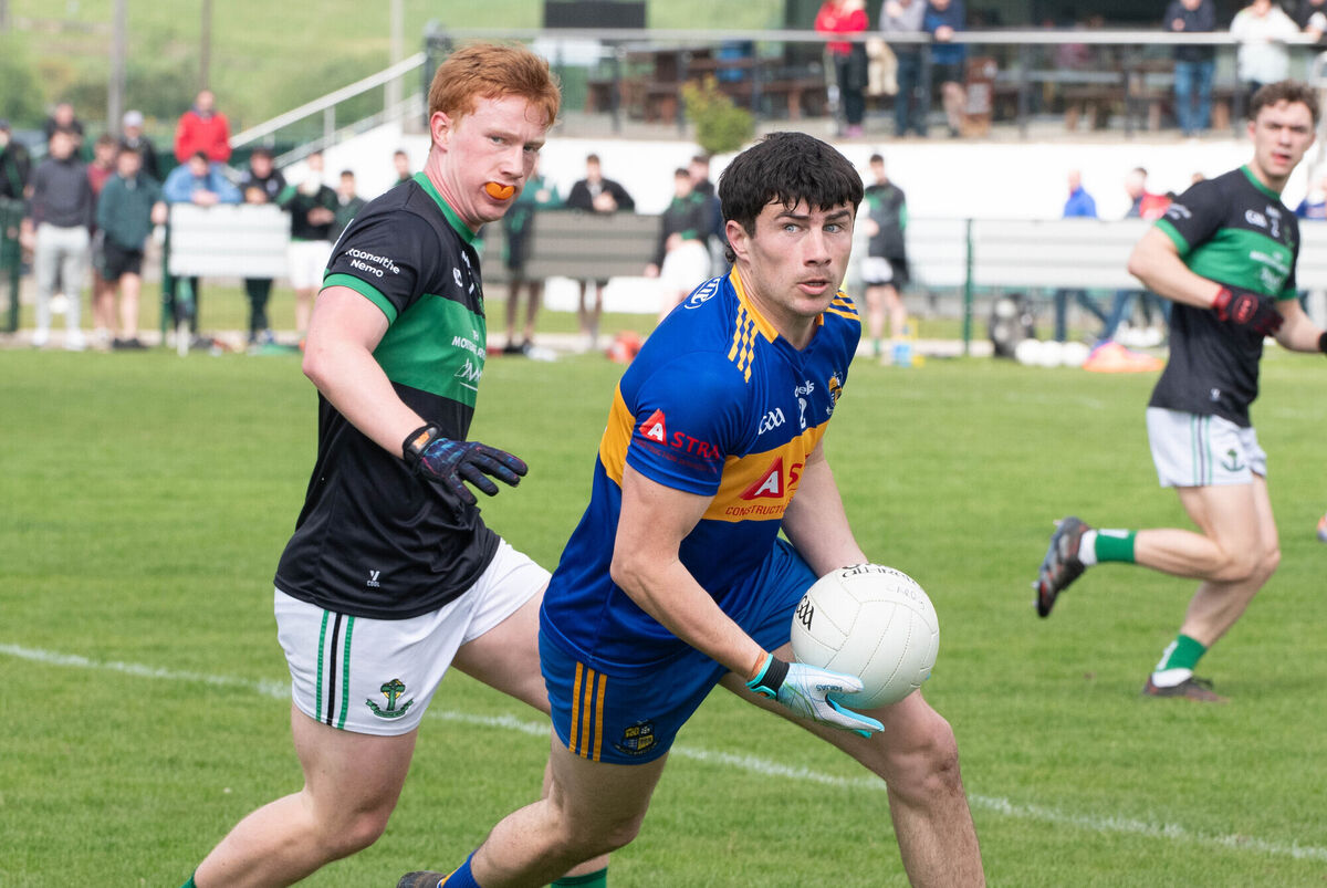 Carrigaline's Darragh King looks for support while being shadowed by Nemo Rangers' Tim O'Brien. Picture: Howard Crowdy Carrigaline's Darragh King looks for support while being shadowed by Nemo Rangers' Tim O'Brien. Picture: Howard Crowdy