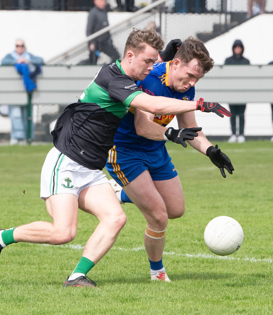 Nemo Rangers' Neville O'Shea and Carrigaline's Eanna Desmond tussle for a loose ball. Picture: Howard Crowdy Nemo Rangers' Neville O'Shea and Carrigaline's Eanna Desmond tussle for a loose ball. Picture: Howard Crowdy