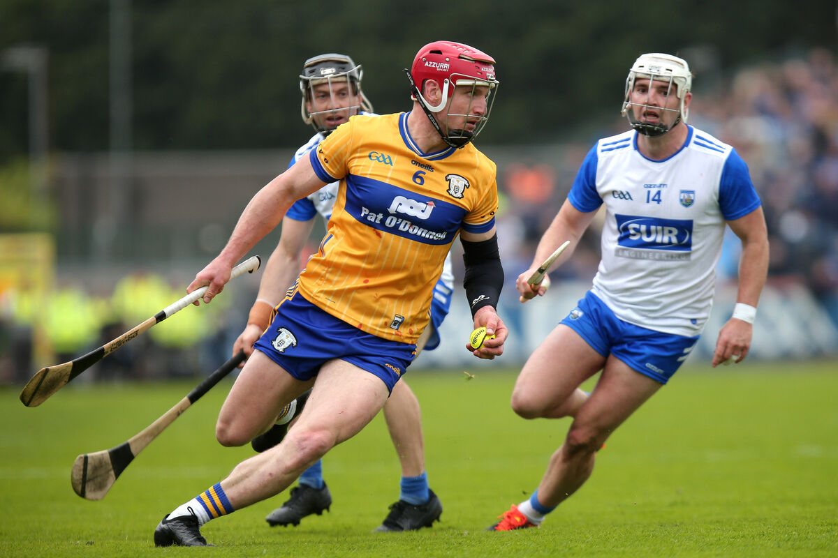 Clare's John Conlon in action against Jamie Barron and Dessie Hutchinson of Waterford.