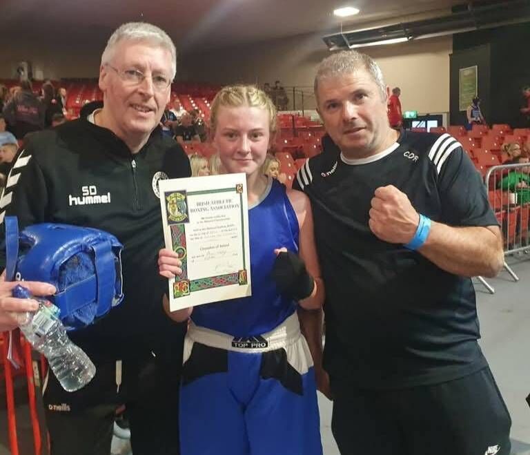 Cork Boxing: Midleton coaches Steve Desmond and Colm O'Riordan with Girl 3 Irish champion Alison Murphy in the National Stadium.