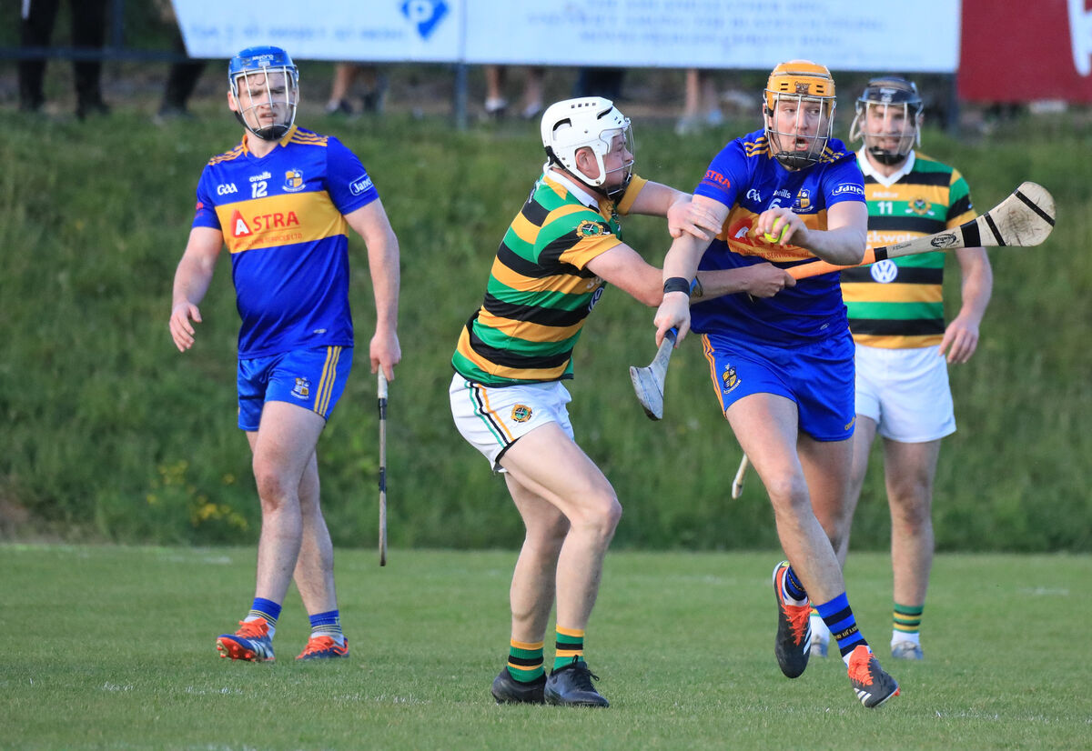 Carrigaline's Kevin Kavanagh tries to pass the Glen's Conor McCarthy. Picture: David Creedon