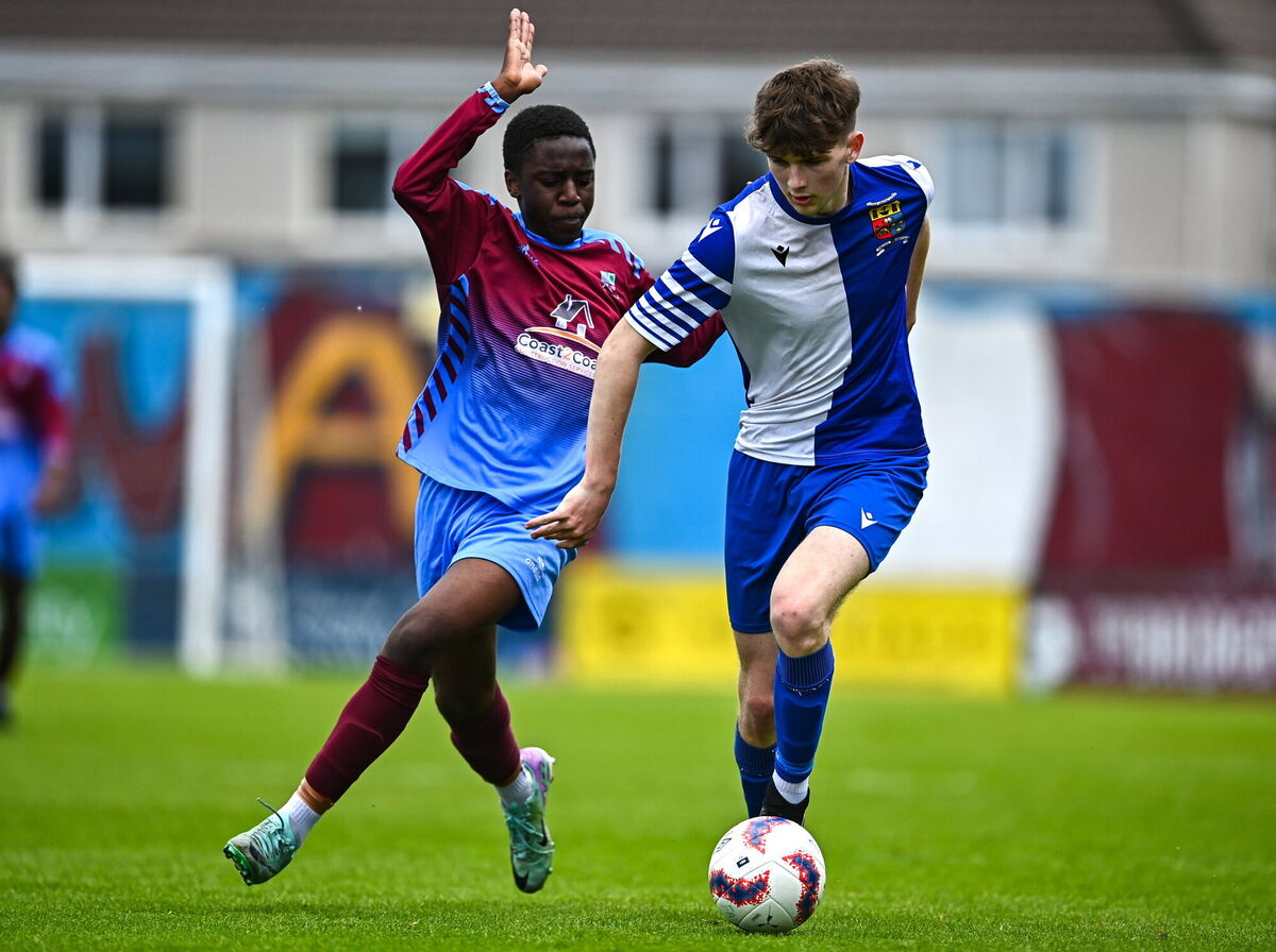 Kai O'Neill of College Corinthians in action against Fergal Takaza of Mervue United. Picture: Tyler Miller/Sportsfile
