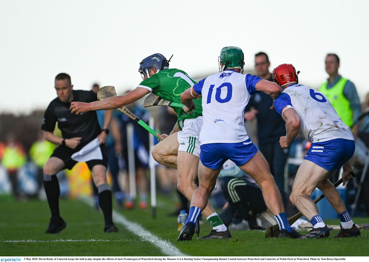 David Reidy of Limerick keeps the ball in play despite the efforts of Jack Prendergast of Waterford.  Picture: Tom Beary/Sportsfile David Reidy of Limerick keeps the ball in play despite the efforts of Jack Prendergast of Waterford.  Picture: Tom Beary/Sportsfile