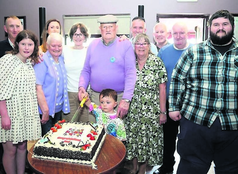 Charlie Drake cutting the celebratory cake with his family during the launch of his book at the Sandpit House Bar & Restaurant, Dromagh, last Sunday Charlie Drake cutting the celebratory cake with his family during the launch of his book at the Sandpit House Bar & Restaurant, Dromagh, last Sunday