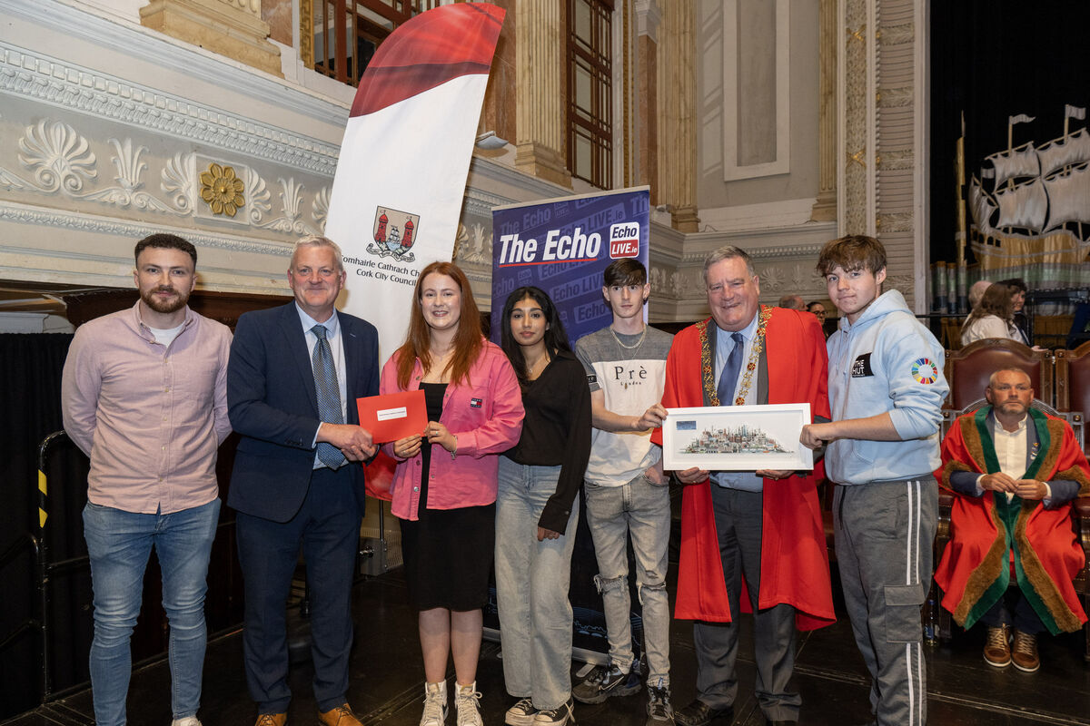 Katie Galgey, Ersha Naheed, Luke Mason, Christopher Delurey, and Joe Curtin of the Hut Youth Project accepting an award.