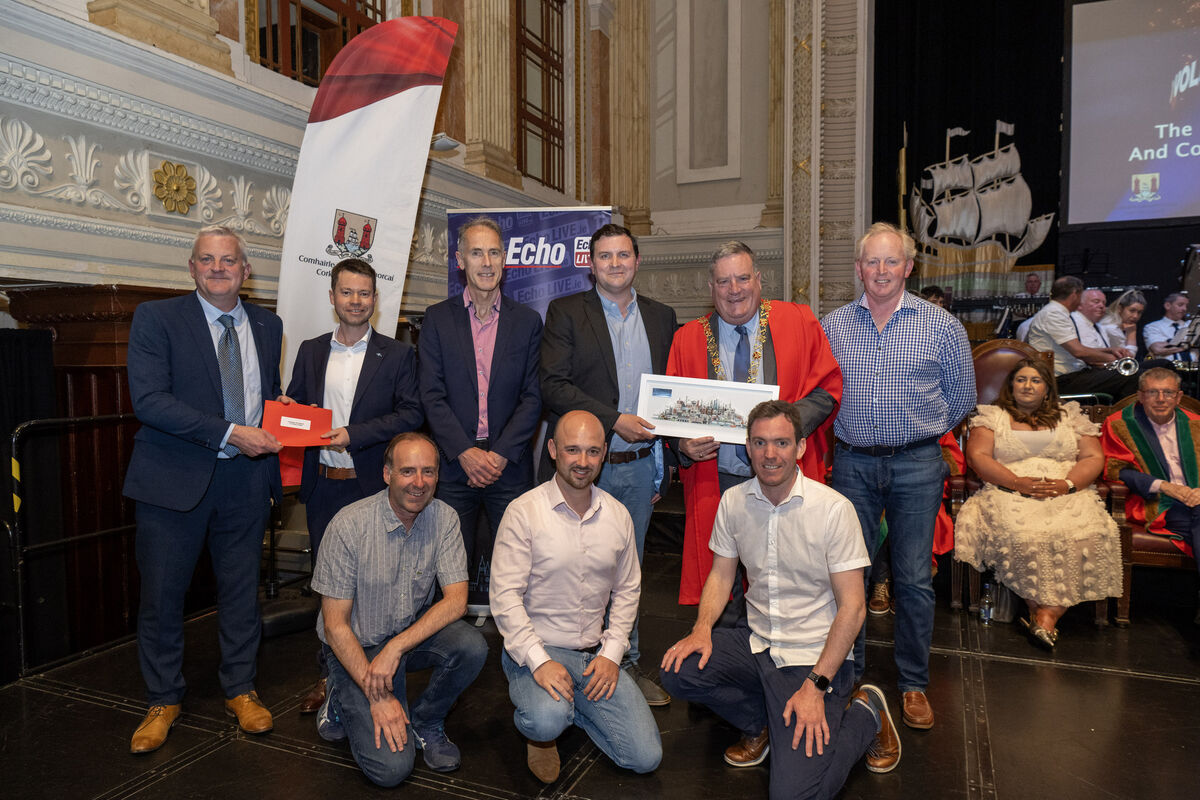 Lord Mayor Cllr Dan Boyle, and John Dolan, features editor, The Echo, presenting an award to Adrian Fitzgerald, John Howard, David O’Neill, Andrew Cronin, Colm Horgan, Iain McGregor, and Paddy Ahearne of Clogheen Kerry Pike Community Association.
