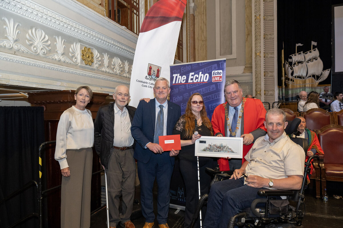 Lord Mayor Cllr Dan Boyle and John Dolan, features editor, The Echo, presenting a Community and Voluntary Award to Cycling for All Cork represented by Agnieszka, Aodhán Quinlan, Nora Delaney, and Tim Hoban.