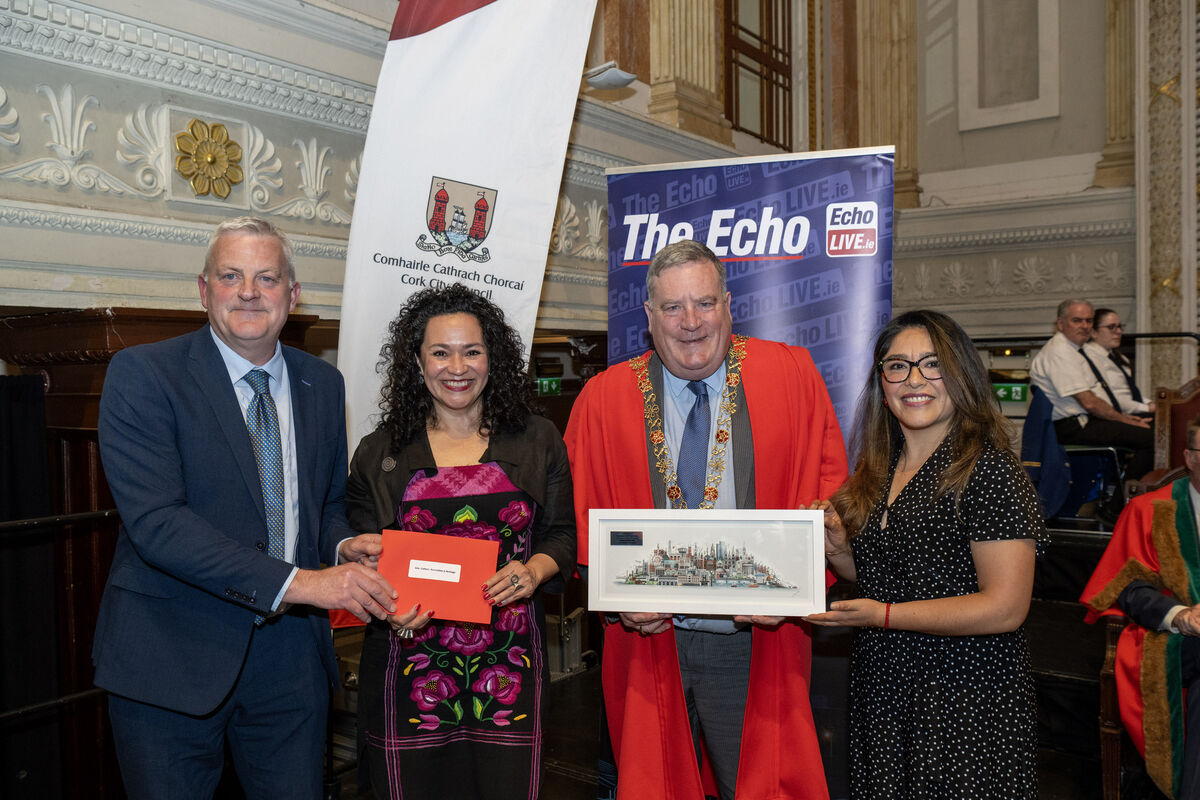 Cecelia Gamez and Diana Estudiante, representing the Mexican Community Cork, accepting an award from Lord Mayor Cllr Dan Boyle and John Dolan, features editor, The Echo.