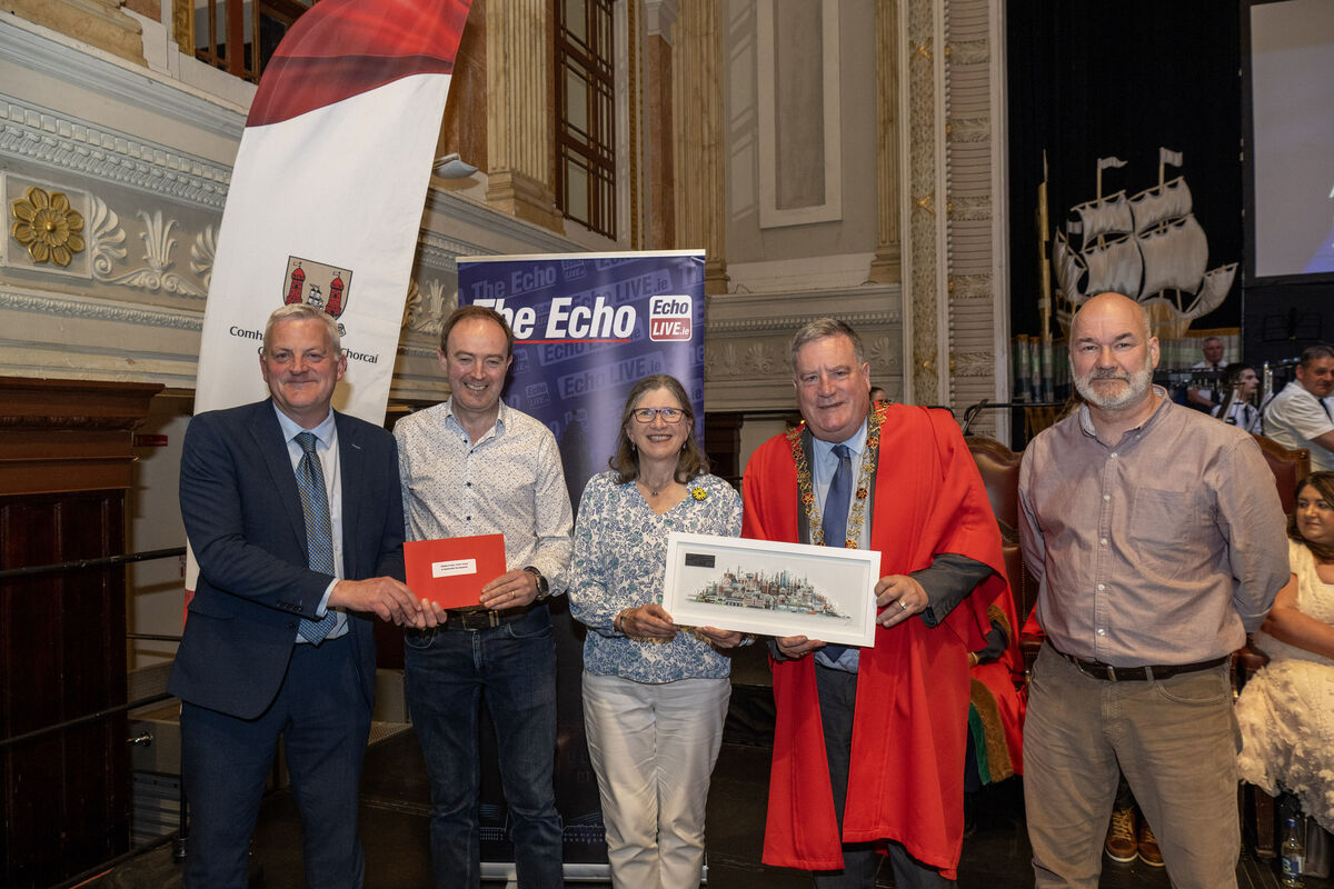 Lord Mayor Cllr Dan Boyle, and John Dolan, features editor, The Echo, presenting an award to Michael McCarthy, Louise Jordan, and Chris Moody of Save Our Bride Otters.