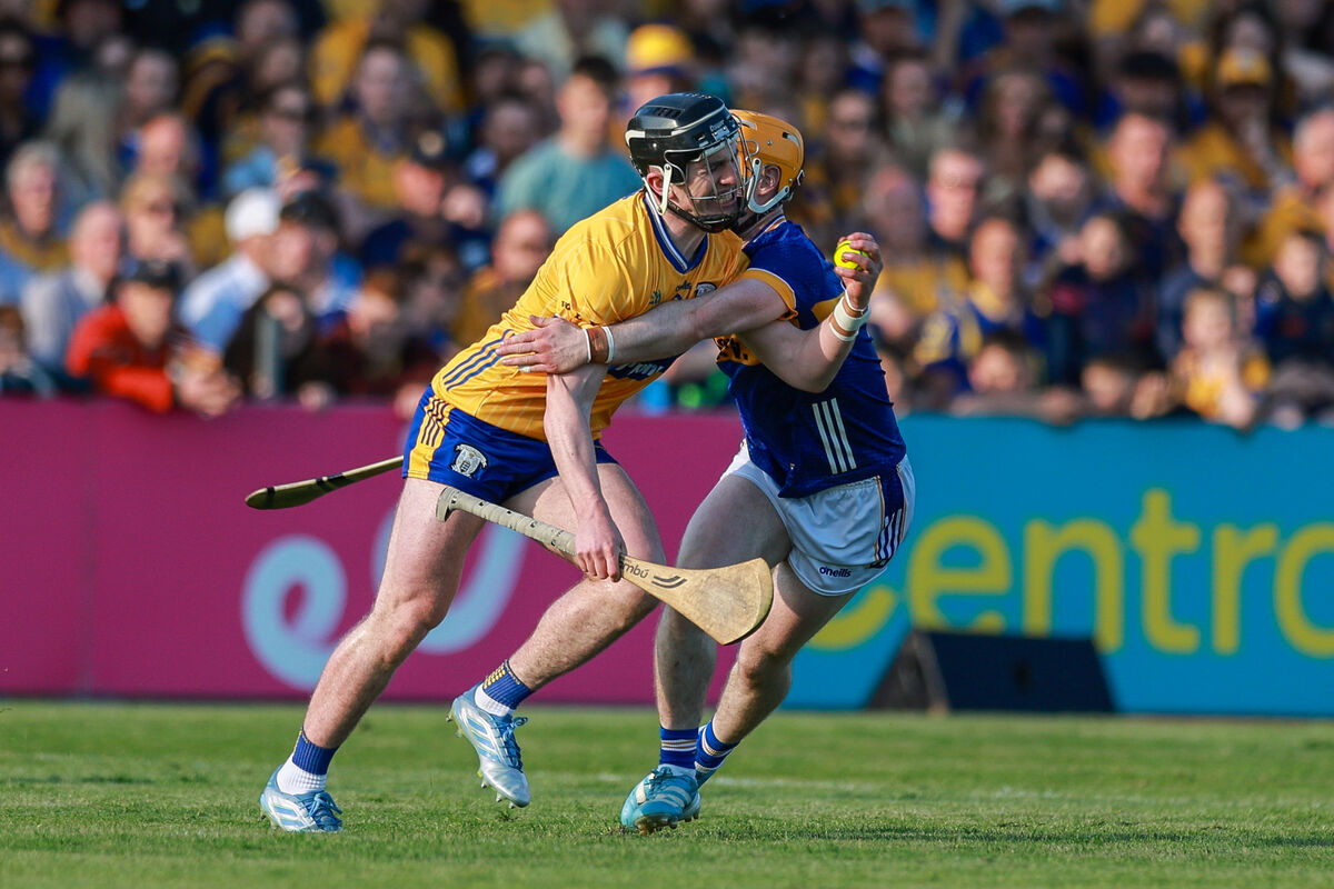 Adam Hogan of Clare is tackled by Andrew Ormond of Tipperary. Picture: ©INPHO/Natasha Barton