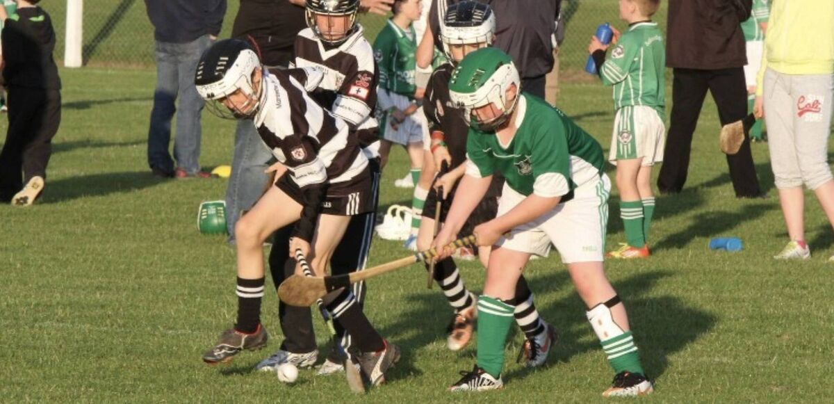 Jack McKay attempting to play hurling, around nine or ten years old.