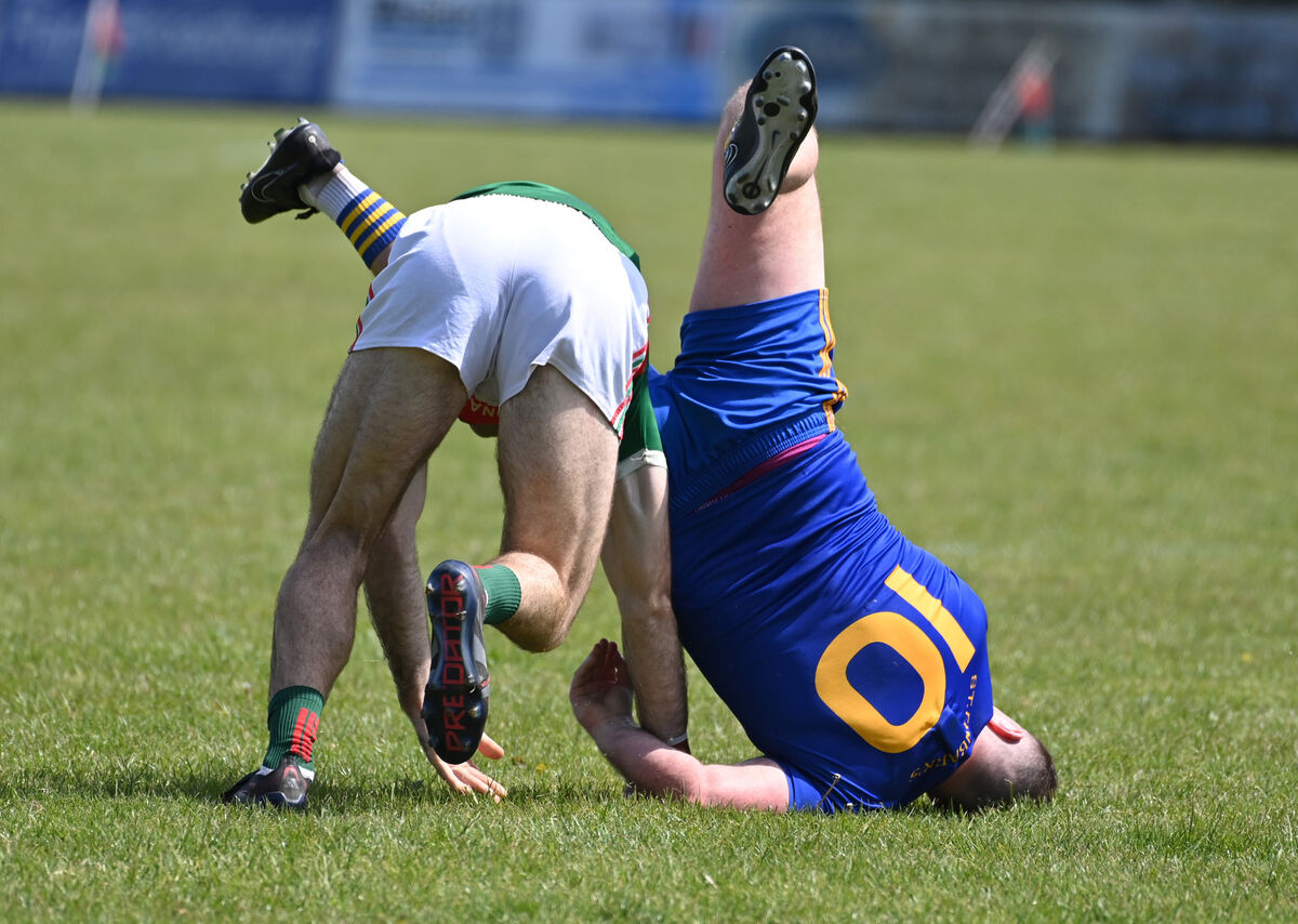 St Finbarrs' Alan McCarthy is upended by Clonakilty's Sean White. Picture: Eddie O'Hare St Finbarrs' Alan McCarthy is upended by Clonakilty's Sean White. Picture: Eddie O'Hare