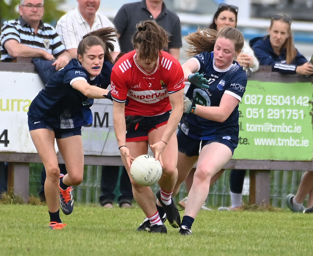Cork's Dara Kiniry gathers the ball from Waterford's Katie Murray and Chloe Fennell. Picture: Eddie O'Hare