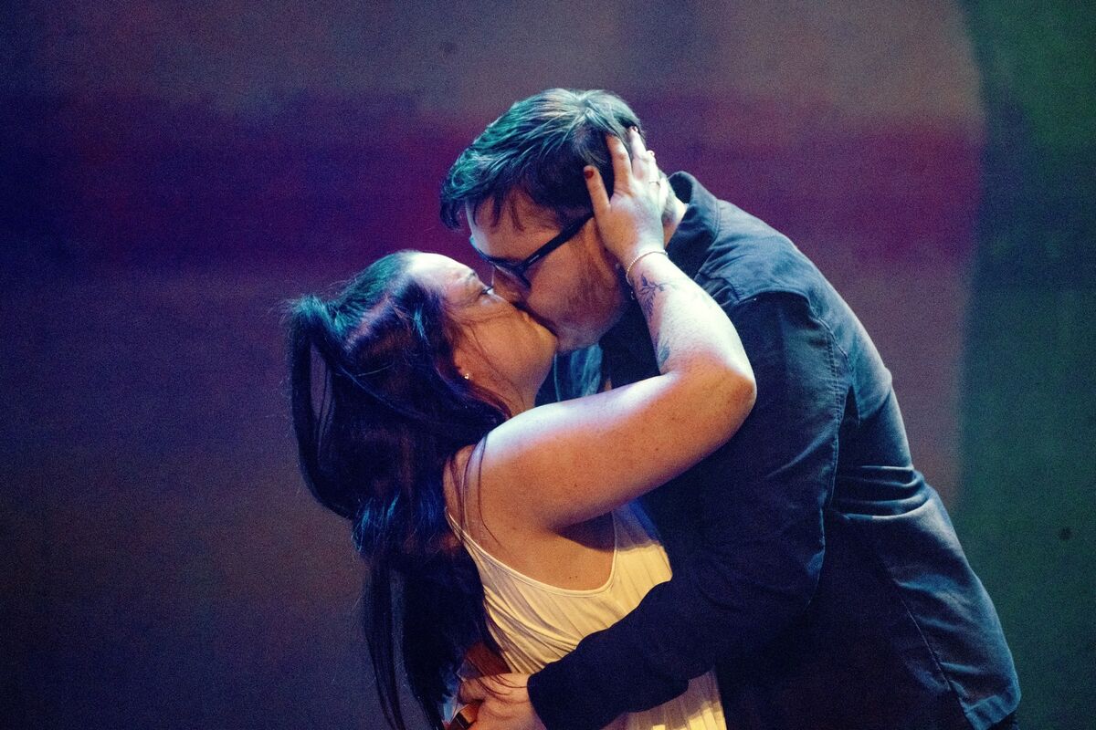 Thomas and Hannah sharing a kiss on stage after the surprise proposal. Picture: Chani Anderson