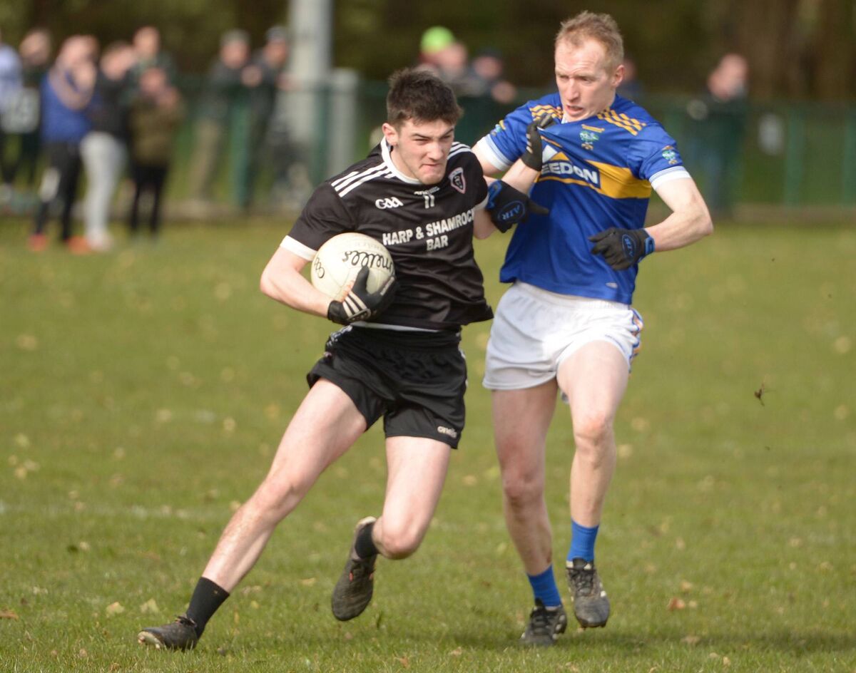 Thomas Casey of Kiskeam attempts to evade the attentions of Eoin Burke of Kilshannig this season. Picture: John Tarrant Thomas Casey of Kiskeam attempts to evade the attentions of Eoin Burke of Kilshannig this season. Picture: John Tarrant