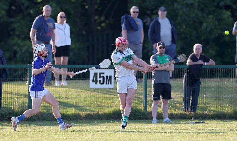  John Wigginton Barrett, St. Finbarrs tries to hook Lorcan McLoughlin, Kanturk. Picture: Jim Coughlan.