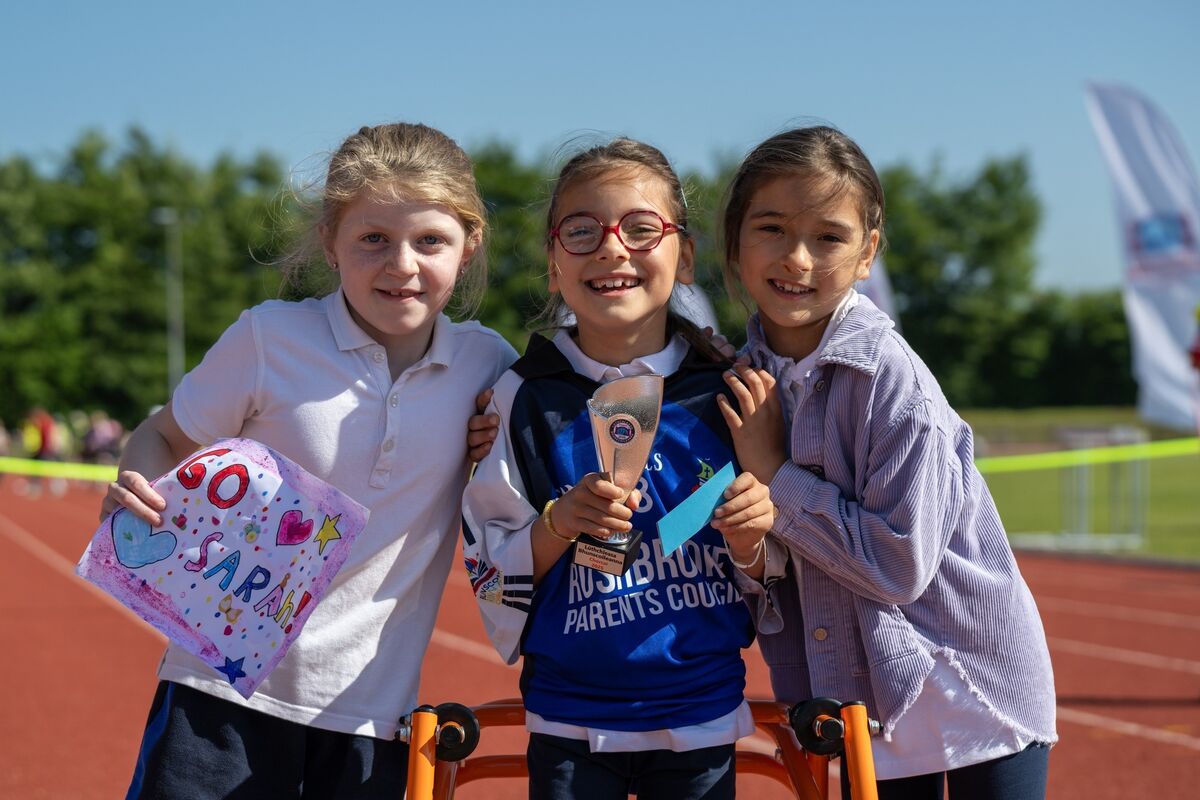 Sarah Grzempa proudly holds aloft her second-place trophy, pictured beside her best friend Rachel Drumgoole and her sister Maya. Picture: Chani Anderson. Sarah Grzempa proudly holds aloft her second-place trophy, pictured beside her best friend Rachel Drumgoole and her sister Maya. Picture: Chani Anderson.