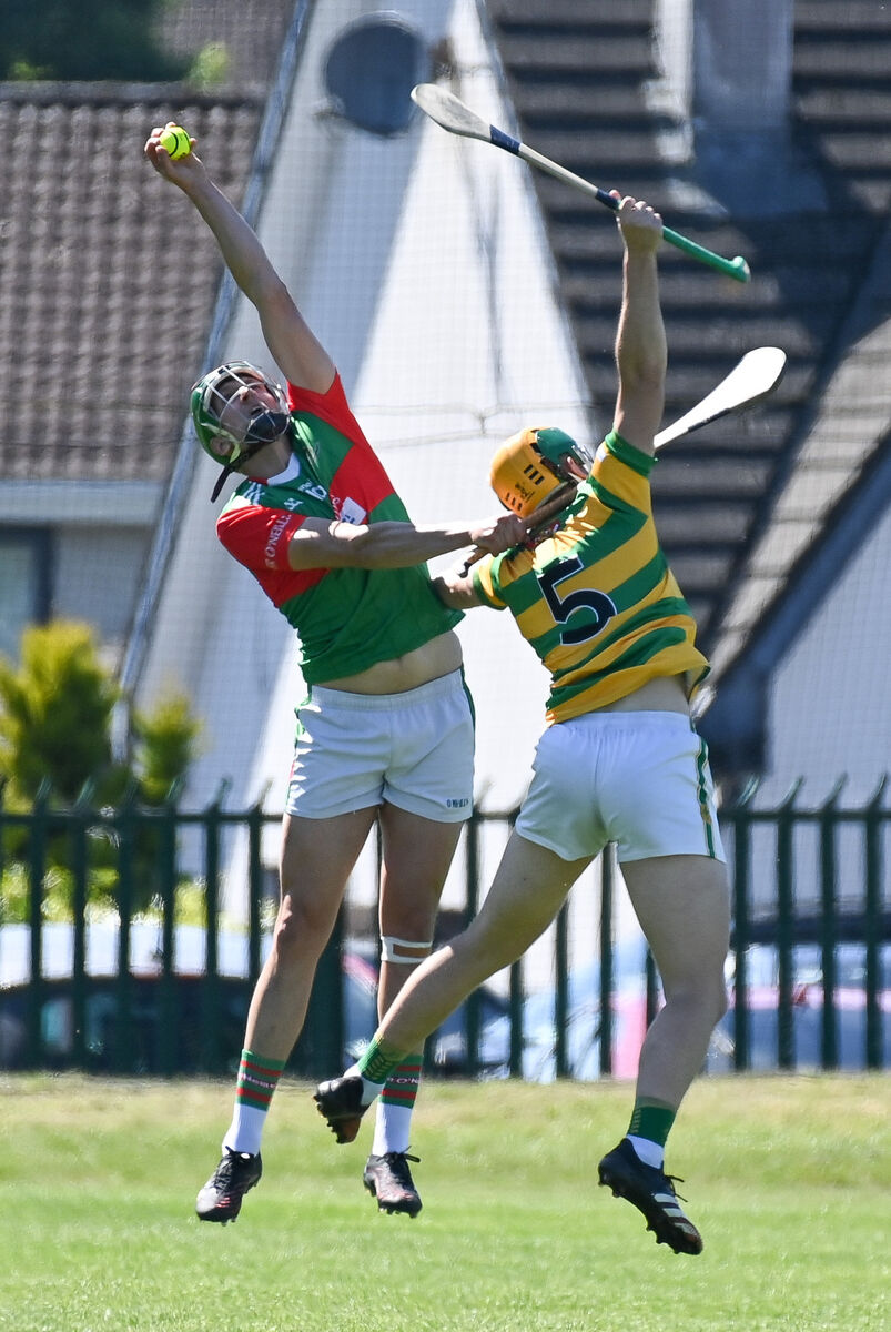 Fr O'Neill's Rob Cullinane makes a fine catch despite the efforts of Blackrock's Alan O'Callaghan. Picture: David Keane. Fr O'Neill's Rob Cullinane makes a fine catch despite the efforts of Blackrock's Alan O'Callaghan. Picture: David Keane.
