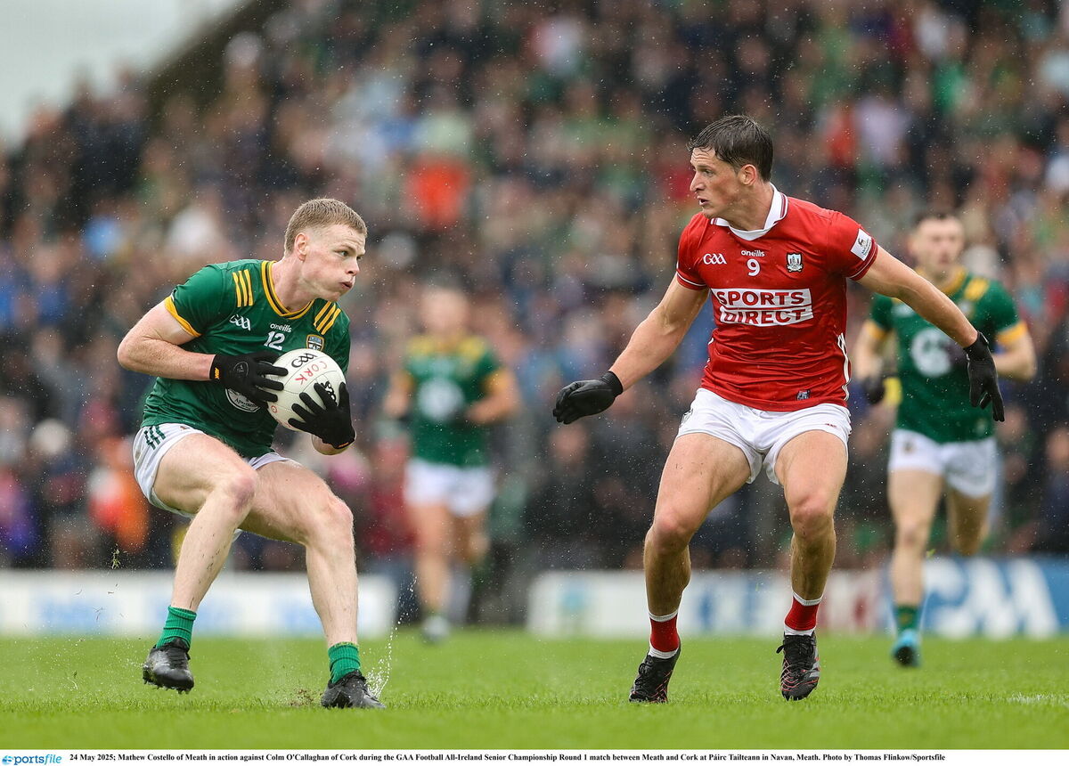 Mathew Costello of Meath in action against Colm O'Callaghan of Cork. Picture: Thomas Flinkow/Sportsfile