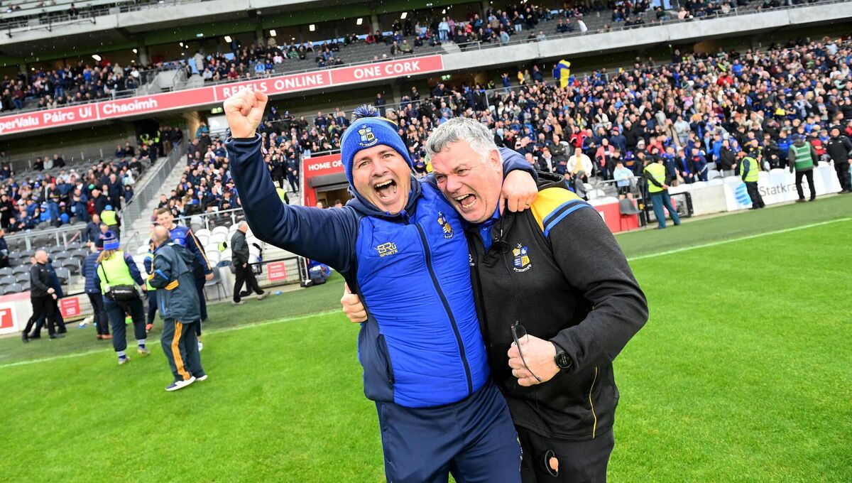 Carrigaline manager Michael Meaney and Alan Murphy celebrate winning the county last season. Picture: Larry Cummins