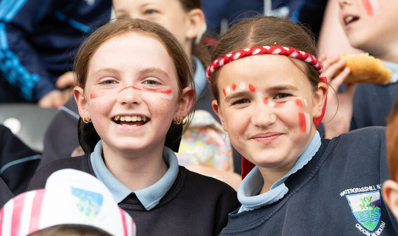 Summer Madden and Maggie Cronin from Watergrasshill seen cheering on their team during the Allianz Urban C2 Sciath na Scol final against Berrings in Super Valu Pairc Ui Chaoimh.. Picture: Howard Crowdy
