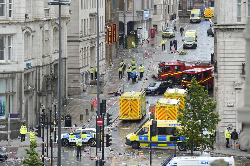 Police and emergency personnel dealing with a road traffic accident on Water Street near the Liver Building in Liverpool.