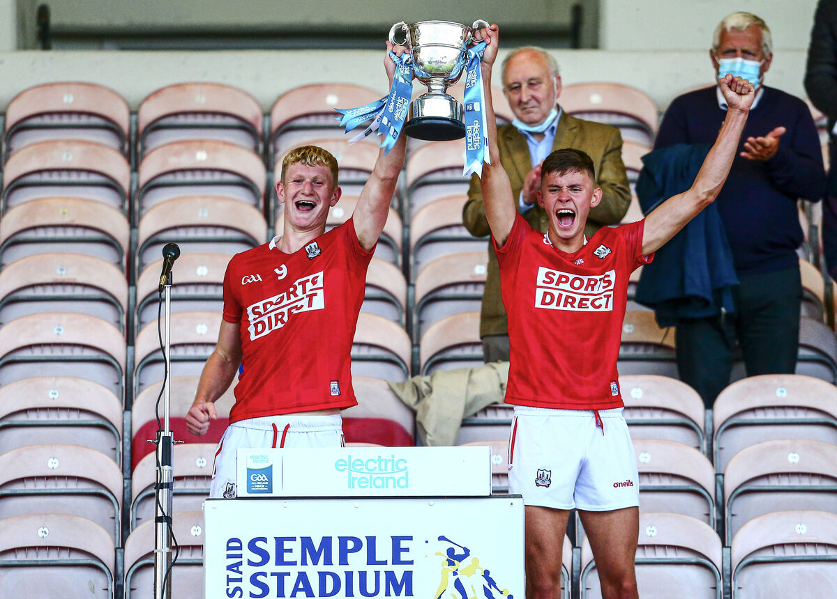 Cork's Rory O'Shaughnessy and Hugh O'Connor lift the Tadhg Crowley Cup in 2021. Picture: INPHO/Ken Sutton