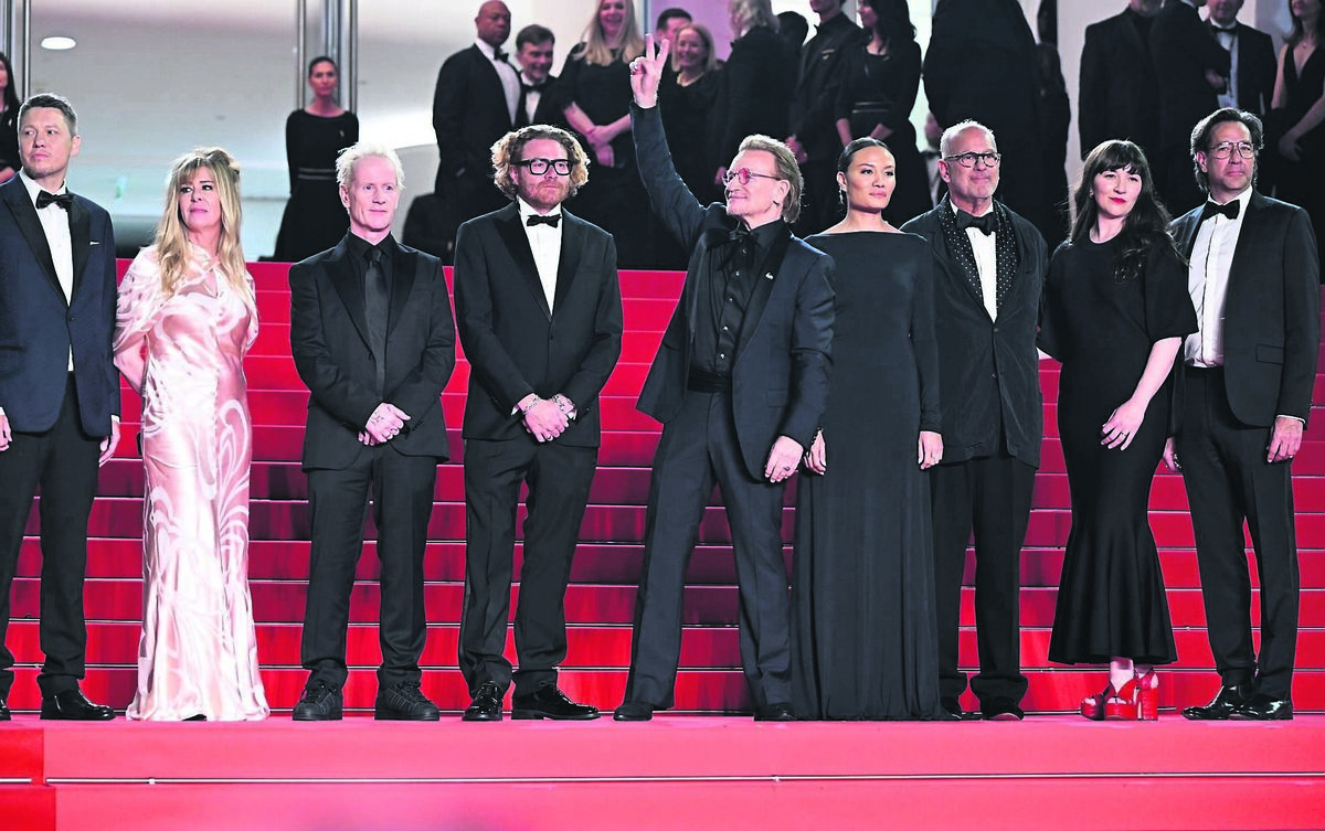 Lasse Jarvi, Dede Gardner, Jacknife Lee, Erik Messerschmidt, Bono, Kelly McNamara, Jon Kamen, Jennifer Pitcher and Dave Sirulnick attend the premiere for “Bono: Stories of Surrender” at the 78th Cannes Film Festival in Cannes, France.  	Pictures: Doug Peters/PA Wire
                    