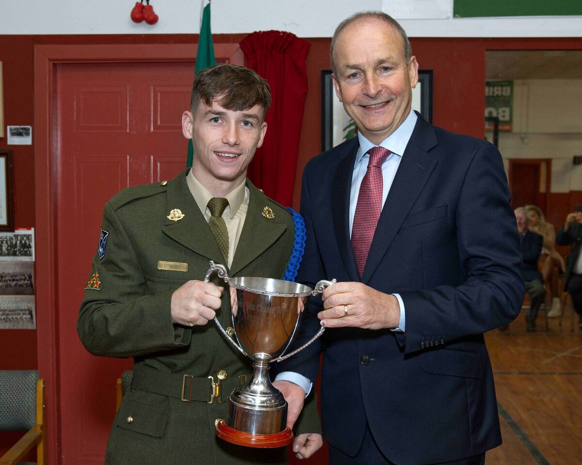 Micheál Martin presenting the Paddy Martin Cup, named in honour of his late father, to Cork's Boxer Of The Year for 2023 Aaron O’Donoghue of Golden Gloves BC. Picture: Doug Minihane