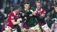 Ruairí Deane and Cattail O'Mahoney tackle Dylan Casey  19/4/2025
