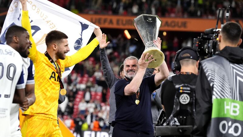 Tottenham Hotspur manager Ange Postecoglou celebrates with the trophy in front of the fans after the final whistle in the UEFA Europa League final at the Estadio de San Mames in Bilbao, Spain. Picture: Nick Potts/PA Wire