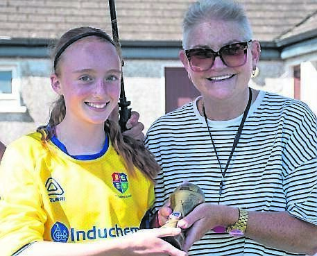 Denise McArdle Moore presents the Player of the Match award to Carrigaline’s Faye Lerner following the CWSSL Denise McArdle Moore U12 Cup Final against Midleton. Pic: Howard Crowdy
                    
