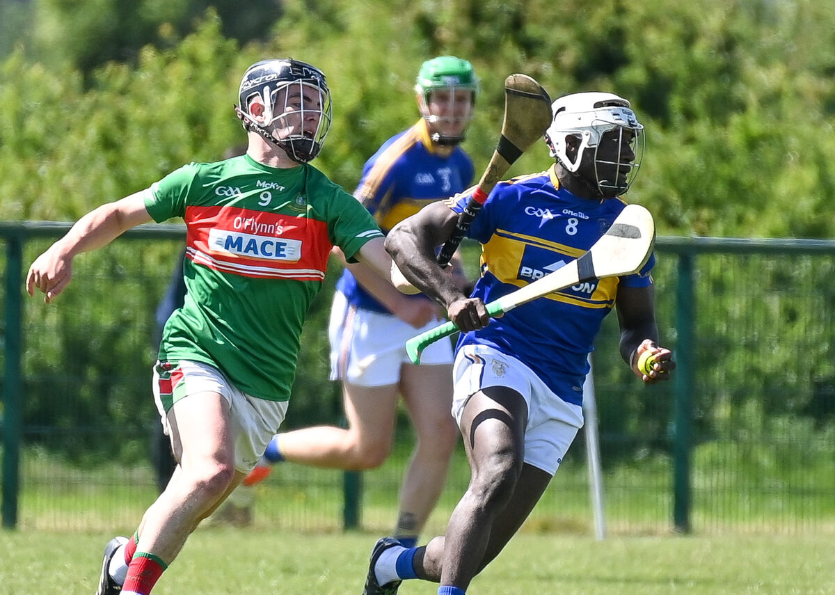  Carrigtwohill's Justin Oke is tackled by Fr O'Neill's Joe Millerick. Picture: David Keane