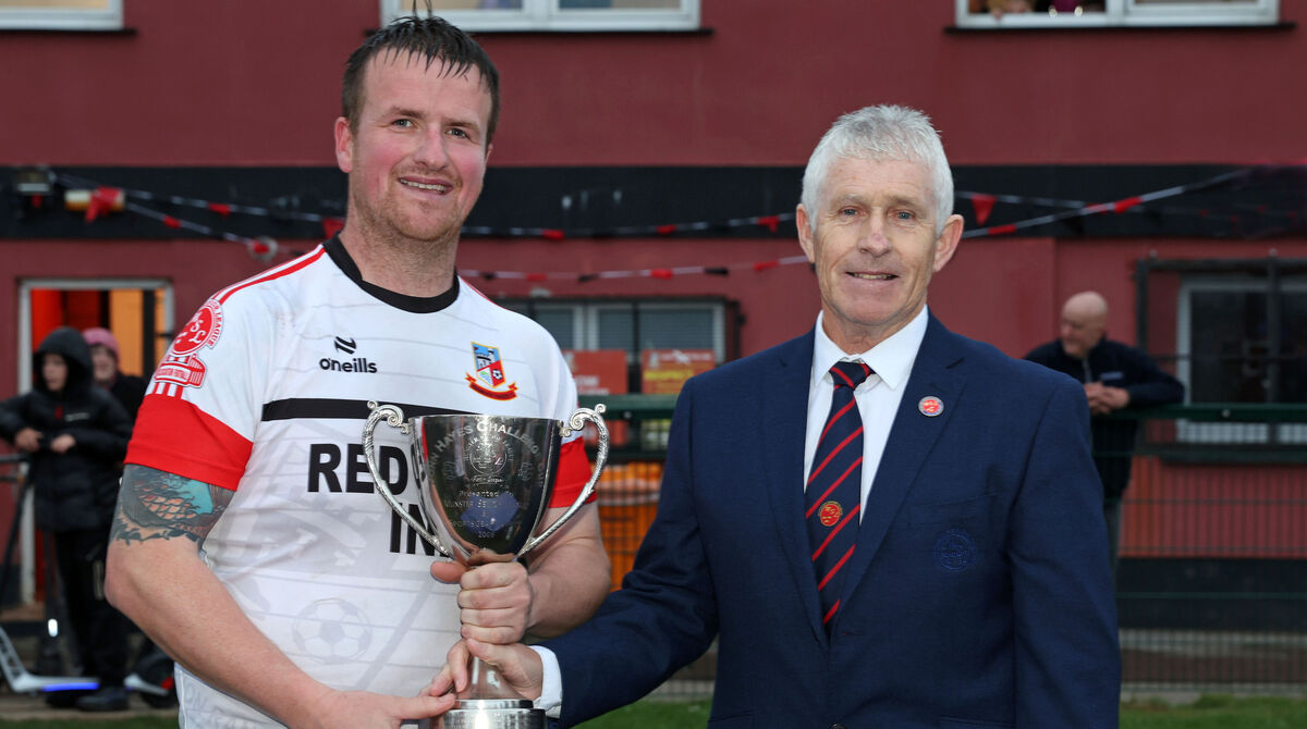 Ringmahon Rangers captain Eoin Murphy, receives the John Hayes Trophy from Munster Senior League chairman John Lyne at Ringmahon Park. Picture: Jim Coughlan
Ringmahon Rangers captain Eoin Murphy, receives the John Hayes Trophy from Munster Senior League chairman John Lyne at Ringmahon Park. Picture: Jim Coughlan
