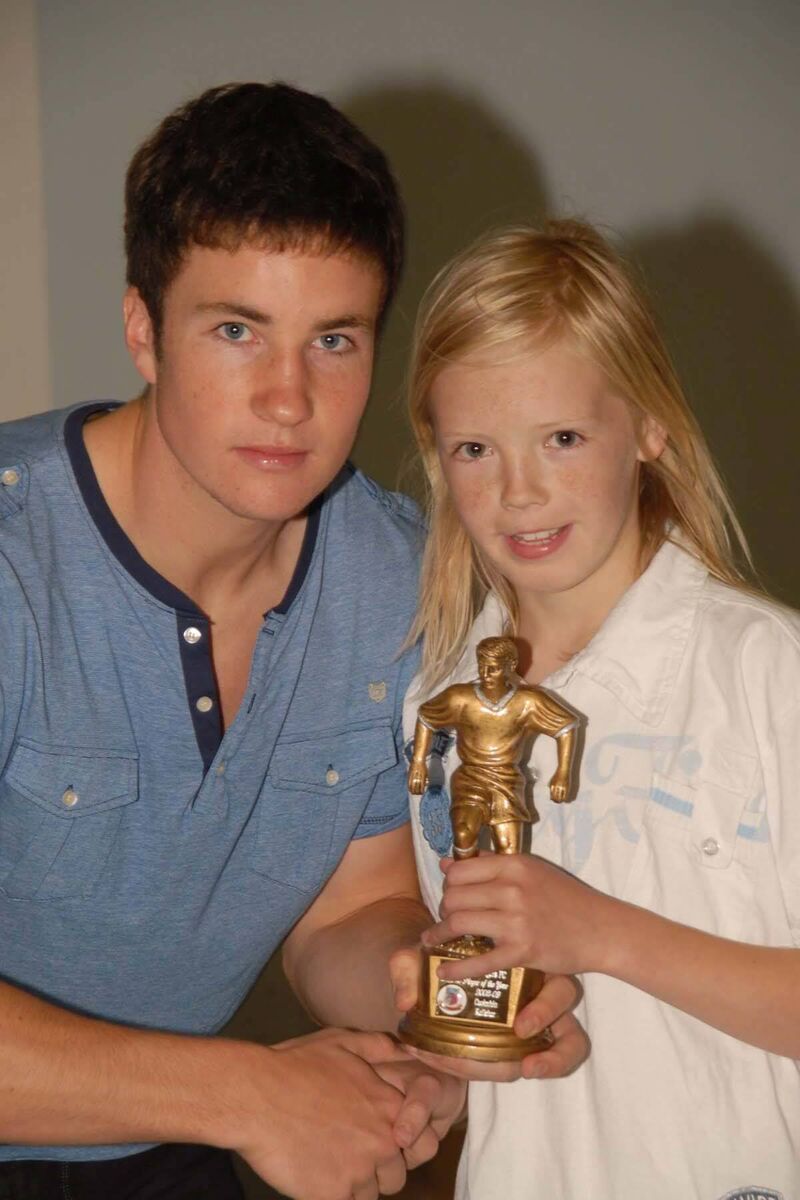 Gearoid Morrissey of Blackburn Rovers FC pictured presenting Caoimhin Kelleher with the U10 Player of the Year Award at the Ringmahon Rangers AFC Under age awards