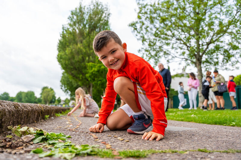 Joey McCarthy from Glanmire placing a coin around the Lough. Picture by Noel Sweeney Joey McCarthy from Glanmire placing a coin around the Lough. Picture by Noel Sweeney